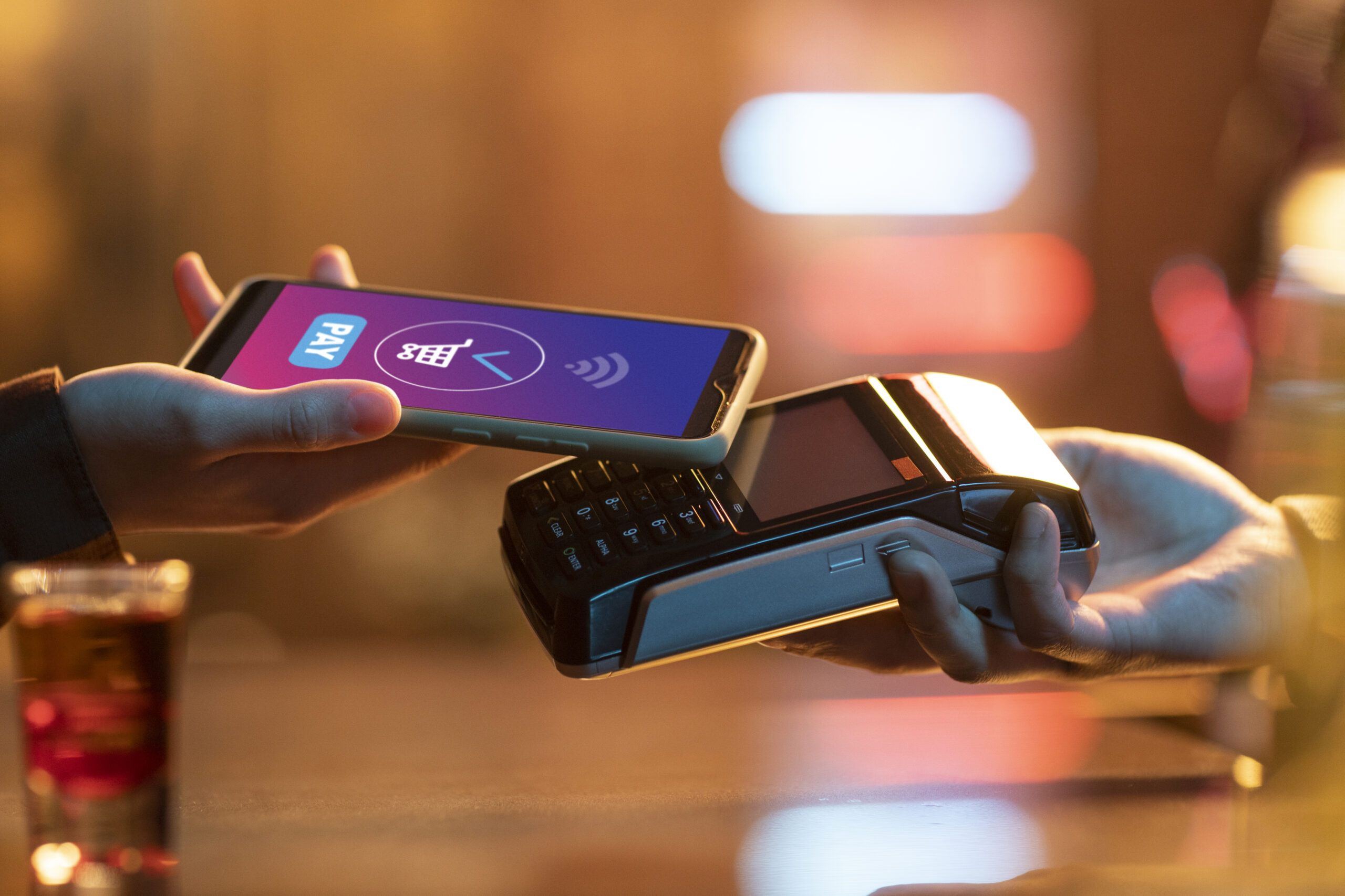 side-view-adult-paying-with-card side view adult paying with card scaled