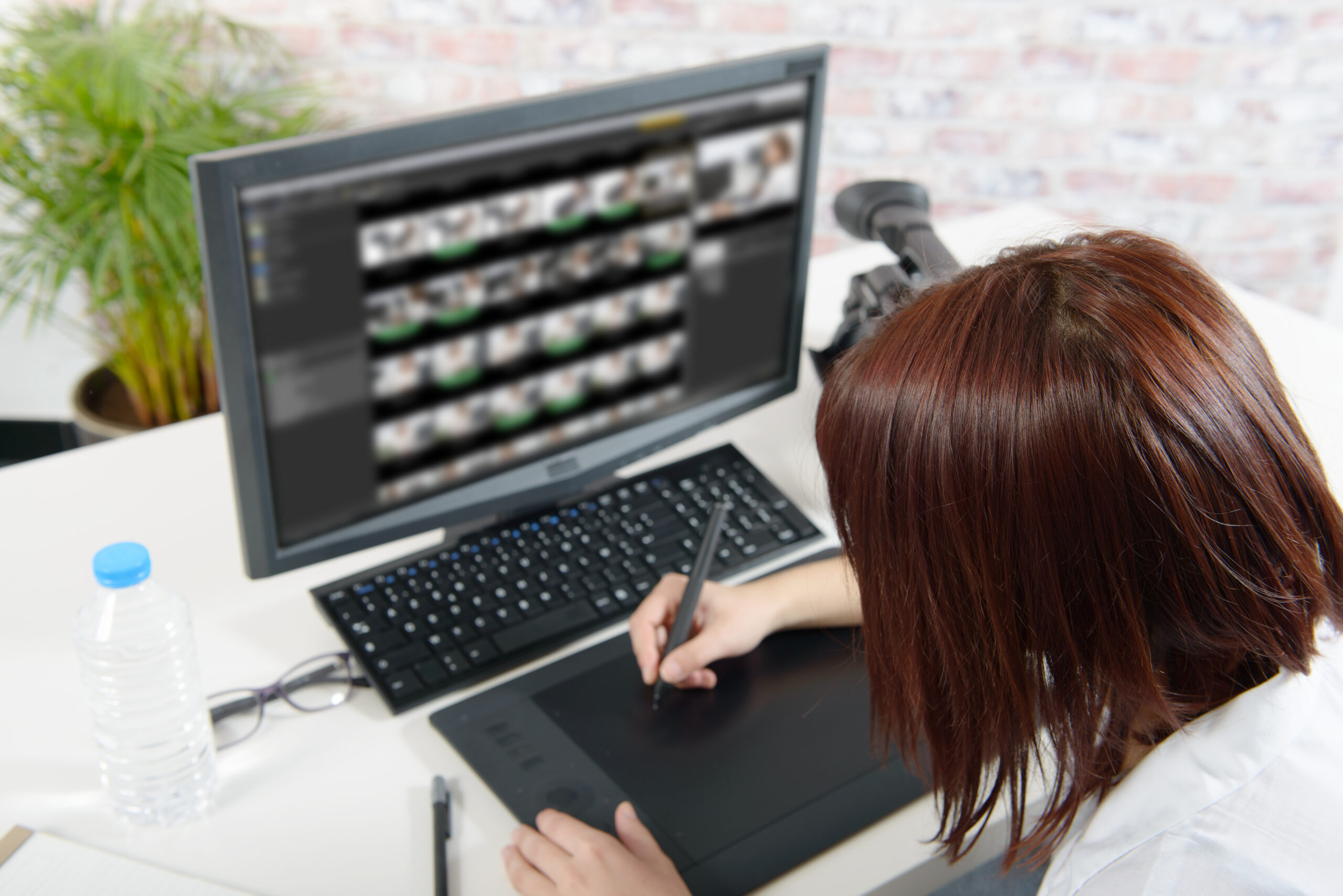 young female designer using graphics tablet scaled